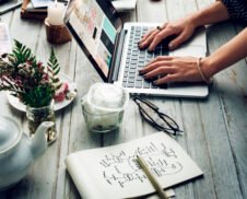 Side view of woman using computer laptop